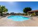 Photo of the sparkling community pool with lounge chairs and a clear blue sky at 319 N Riata St, Gilbert, AZ 85234