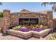 Stonebridge Lakes community sign with vibrant floral arrangements at 319 N Riata St, Gilbert, AZ 85234
