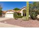 Well-maintained single-Gathering house with mature desert landscaping, a tile roof, and ample parking at 319 N Riata St, Gilbert, AZ 85234