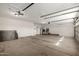Open garage with concrete floor and garage door at 319 N Riata St, Gilbert, AZ 85234