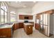 Well-lit kitchen featuring stainless steel appliances, a center island, and ample countertop space at 319 N Riata St, Gilbert, AZ 85234
