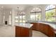 Bright kitchen featuring a center island, modern countertops and cabinetry, and ample natural light at 319 N Riata St, Gilbert, AZ 85234