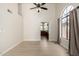 Bright living room with large windows and neutral walls, showcasing the open layout at 319 N Riata St, Gilbert, AZ 85234