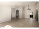 Spacious, open-concept living area featuring light hardwood floors and neutral paint colors at 319 N Riata St, Gilbert, AZ 85234