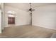 Living room featuring modern hardwood floors, neutral paint, and modern ceiling fan at 319 N Riata St, Gilbert, AZ 85234