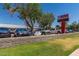 A parking lot in front of Burk Elementary School with various cars parked in front of the school sign at 319 N Riata St, Gilbert, AZ 85234
