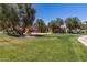 Community playground featuring swings, slides, and a sandy play area at 319 N Riata St, Gilbert, AZ 85234