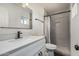 Updated bathroom with a modern vanity, sleek fixtures, and a tiled walk-in shower at 325 E Harmony Ave, Mesa, AZ 85210