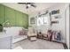Charming Bedroom with a plush rug, floral accents, and a cozy rocking chair at 325 E Harmony Ave, Mesa, AZ 85210