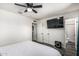 Minimalist bedroom featuring a large closet and a view of the adjacent bathroom at 325 E Harmony Ave, Mesa, AZ 85210