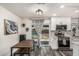 Modern kitchen featuring stainless steel appliances, white cabinetry, mosaic backsplash and a sliding glass door to the pool area at 325 E Harmony Ave, Mesa, AZ 85210