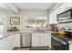 Efficient kitchen layout with stainless steel appliances, granite countertops, and modern finishes at 3505 S Westfall Ave, Tempe, AZ 85282