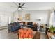 Comfortable living room with a large sectional sofa, hardwood floors, and neutral decor at 3505 S Westfall Ave, Tempe, AZ 85282