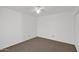 Cozy bedroom with plush neutral carpet, white walls, and a ceiling fan for added comfort at 3510 E Hampton Ave # 18, Mesa, AZ 85204