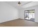 Spacious bedroom with neutral carpet and sliding glass doors to the patio at 3510 E Hampton Ave # 18, Mesa, AZ 85204