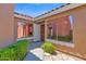 Front entry showcasing large windows providing ample light and a stylish wooden front door at 3510 E Hampton Ave # 18, Mesa, AZ 85204