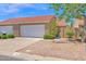 Attractive home with two-car garage, xeriscaping, and a striking terracotta roof under a blue sky at 3510 E Hampton Ave # 18, Mesa, AZ 85204