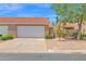 Charming home featuring a two-car garage, desert landscaping, and a classic red tile roof under a sunny sky at 3510 E Hampton Ave # 18, Mesa, AZ 85204