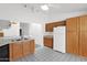 Bright kitchen with oak cabinets, white appliances, and an open view at 3510 E Hampton Ave # 18, Mesa, AZ 85204