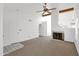 Spacious living room with neutral carpeting, a cozy fireplace, and an open layout great for entertaining at 3510 E Hampton Ave # 18, Mesa, AZ 85204