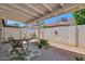 Charming covered patio with a table and chairs, perfect for outdoor relaxation and entertaining at 3510 E Hampton Ave # 18, Mesa, AZ 85204