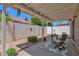 Relaxing covered patio, featuring a leafy rug, brick border, and neutral wall at 3510 E Hampton Ave # 18, Mesa, AZ 85204