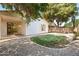 The backyard features a grassy area, desert landscaping, and covered patio with sliding glass doors at 3534 E Linda Ln, Gilbert, AZ 85234