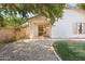 This backyard has a covered patio, desert landscaping and a well maintained grassy area at 3534 E Linda Ln, Gilbert, AZ 85234