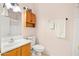 Bathroom featuring a vanity with a mirror, a toilet, and a shower with a curtain at 3534 E Linda Ln, Gilbert, AZ 85234