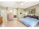 Serene bedroom featuring wood flooring, classic furnishings, and an en-suite bathroom for added privacy and convenience at 3534 E Linda Ln, Gilbert, AZ 85234