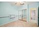 A spacious bedroom with blue walls, a sliding mirror closet, and a ceiling fan at 3534 E Linda Ln, Gilbert, AZ 85234