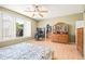 Bright bedroom with wood flooring, a large window, and ample closet space, designed for comfort and functionality at 3534 E Linda Ln, Gilbert, AZ 85234