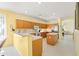 Bright kitchen with wood cabinets, tile floors, breakfast bar, and modern appliances, perfect for cooking at 3534 E Linda Ln, Gilbert, AZ 85234