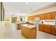 Spacious kitchen featuring a center island, bright lighting, stainless steel appliances, and a tile backsplash at 3534 E Linda Ln, Gilbert, AZ 85234
