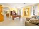 Bright and airy living room with neutral paint, tile flooring, and abundant natural light through sheer curtains at 3534 E Linda Ln, Gilbert, AZ 85234