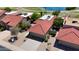 Aerial view showcasing the red tile roof, two car garage, and lush landscaping at 4225 E Sandia St, Phoenix, AZ 85044