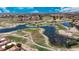 Aerial view showcasing the community golf course with waterways surrounded by residential homes at 4225 E Sandia St, Phoenix, AZ 85044