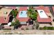 Aerial view showcasing the red tile roofs, patios, lush landscaping, and desert landscape at 4225 E Sandia St, Phoenix, AZ 85044