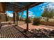 View of the covered brick patio overlooking the lush green community golf course at 4225 E Sandia St, Phoenix, AZ 85044