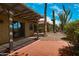 View of the covered patio with a desert landscaped backyard with cacti and stone groundcover at 4225 E Sandia St, Phoenix, AZ 85044