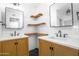 This bathroom has two sinks, modern shelving, and hexagon tile flooring at 4225 E Sandia St, Phoenix, AZ 85044