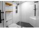 This modern bathroom features sleek, white tile, and hexagon tile flooring at 4225 E Sandia St, Phoenix, AZ 85044