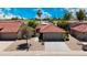 Charming front exterior with a low-maintenance desert landscape, two car garage, and tile roof at 4225 E Sandia St, Phoenix, AZ 85044