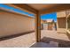 This backyard features neutral gravel, a covered patio, and a fence for added privacy at 5113 E Greenway E St, Mesa, AZ 85205