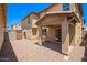 A gravel-filled backyard with a covered patio on a sunny day, perfect for outdoor entertaining at 5113 E Greenway E St, Mesa, AZ 85205