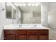 Bathroom featuring a double sink vanity with dark wood cabinetry and neutral countertop at 5113 E Greenway E St, Mesa, AZ 85205