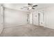Spacious bedroom with neutral walls and plush carpeting, complete with a ceiling fan at 5113 E Greenway E St, Mesa, AZ 85205