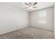 Bedroom featuring neutral walls and carpet with a ceiling fan and a window for natural light at 5113 E Greenway E St, Mesa, AZ 85205