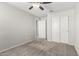 Bedroom featuring neutral walls and carpet, a ceiling fan, and a sliding door closet at 5113 E Greenway E St, Mesa, AZ 85205