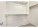 Walk-in closet with carpeted floors, white walls, and built-in shelving at 5113 E Greenway E St, Mesa, AZ 85205